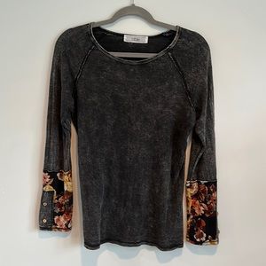 Super soft long sleeve top with floral cuffs and wood button detail.  Size M